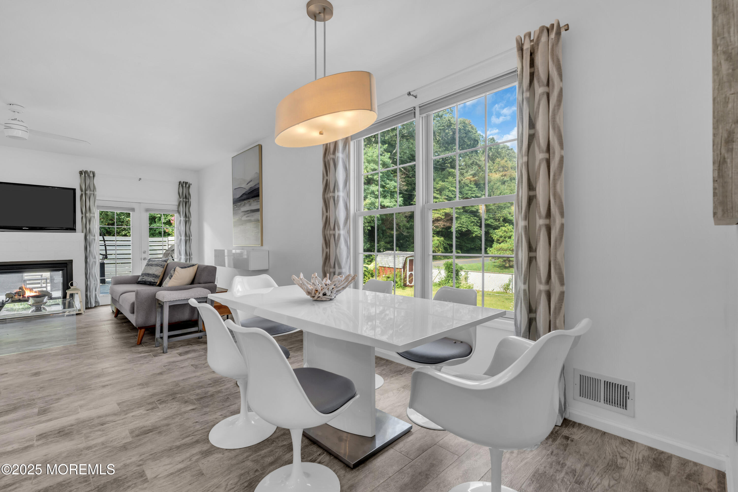 12 Locust Street Highlands, NJ 07732 - Photo 13 of 47 a dining room with furniture a chandelier and wooden floor