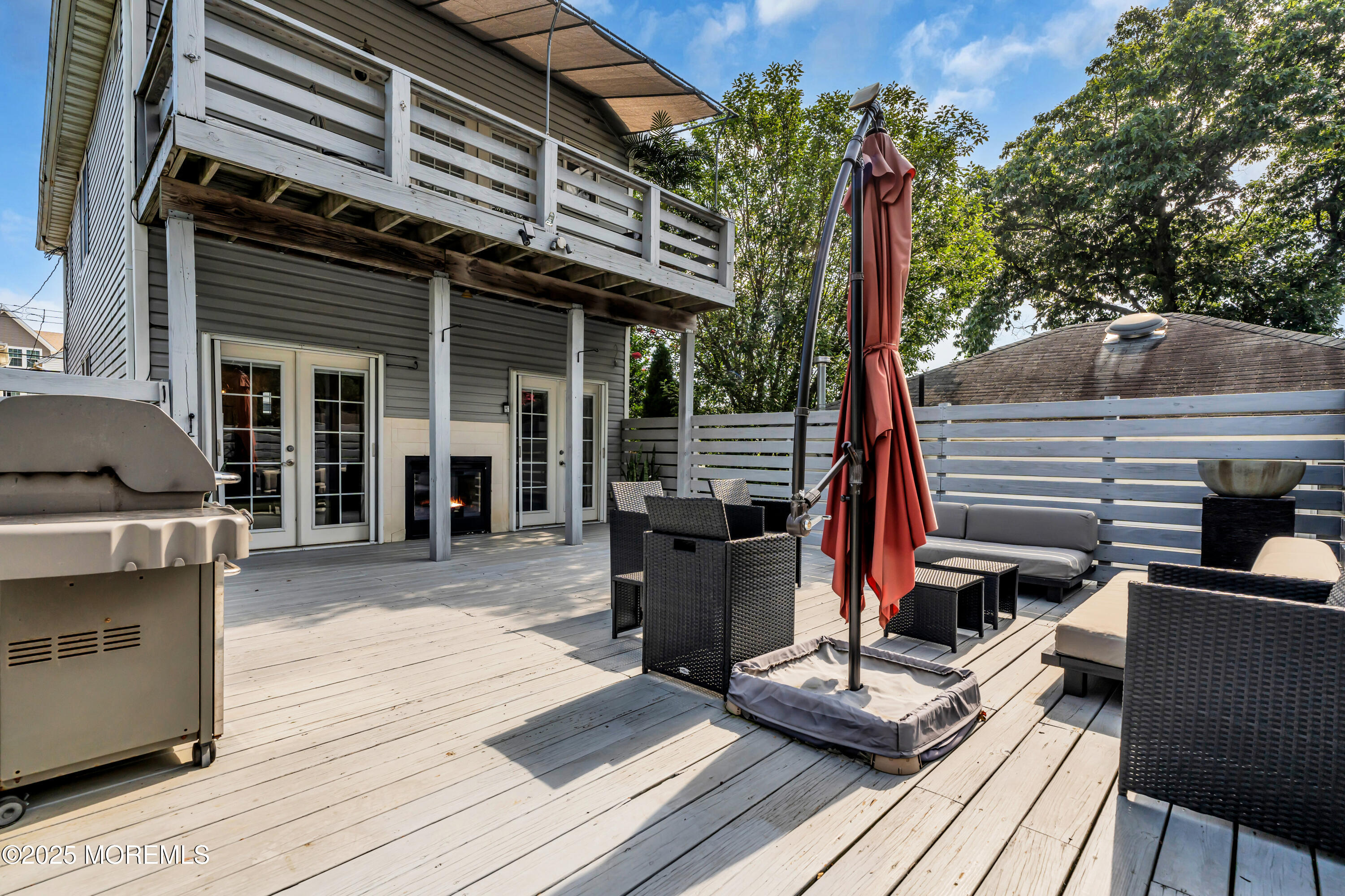 12 Locust Street Highlands, NJ 07732 - Photo 22 of 47 a view of a dinning tables and chairs in patio of the house