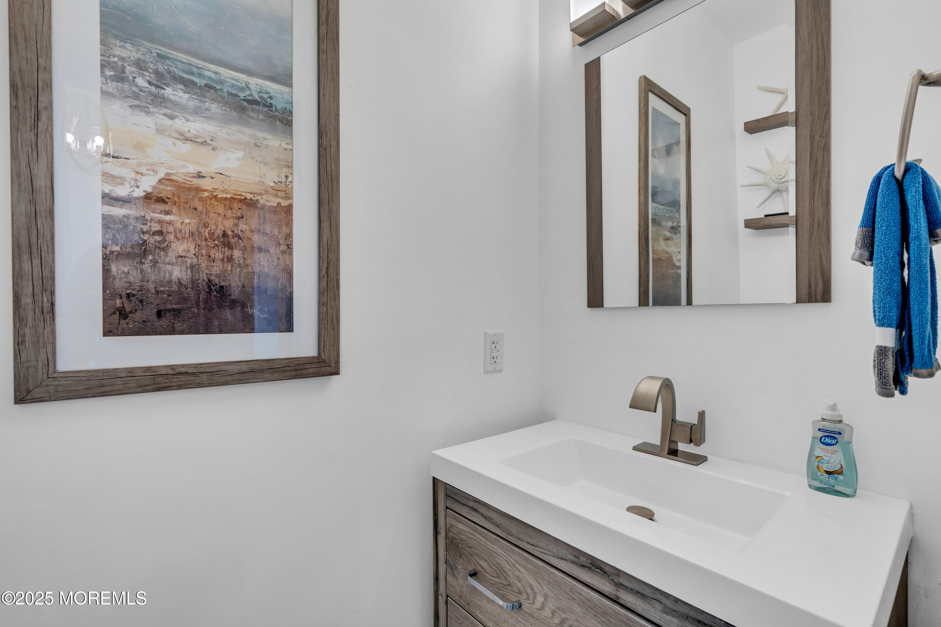 12 Locust Street Highlands, NJ 07732 - Photo 28 of 47 a bathroom with a sink and a mirror