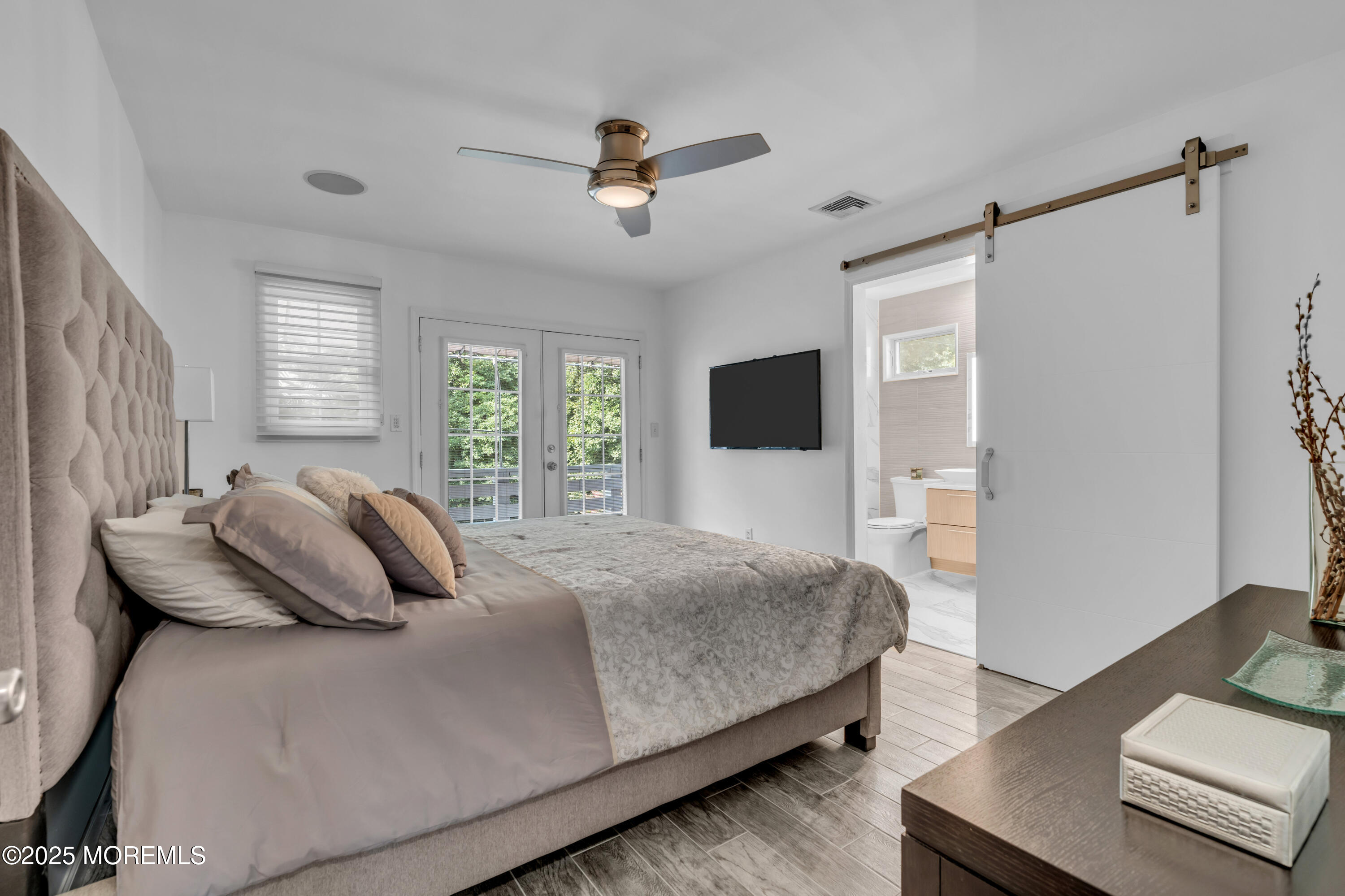 12 Locust Street Highlands, NJ 07732 - Photo 34 of 47 a bedroom with a bed and a television