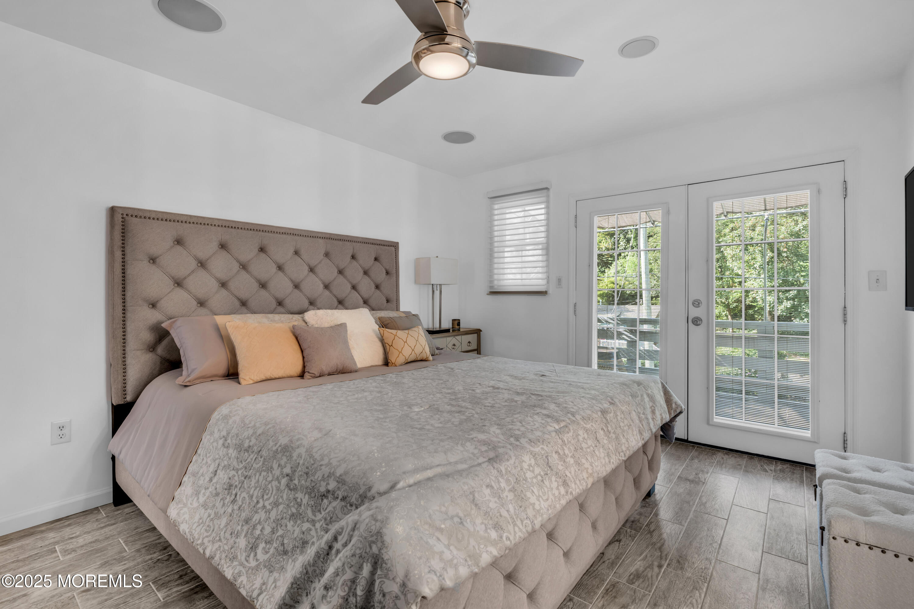 12 Locust Street Highlands, NJ 07732 - Photo 35 of 47 a large bed sitting in a bedroom next to a window