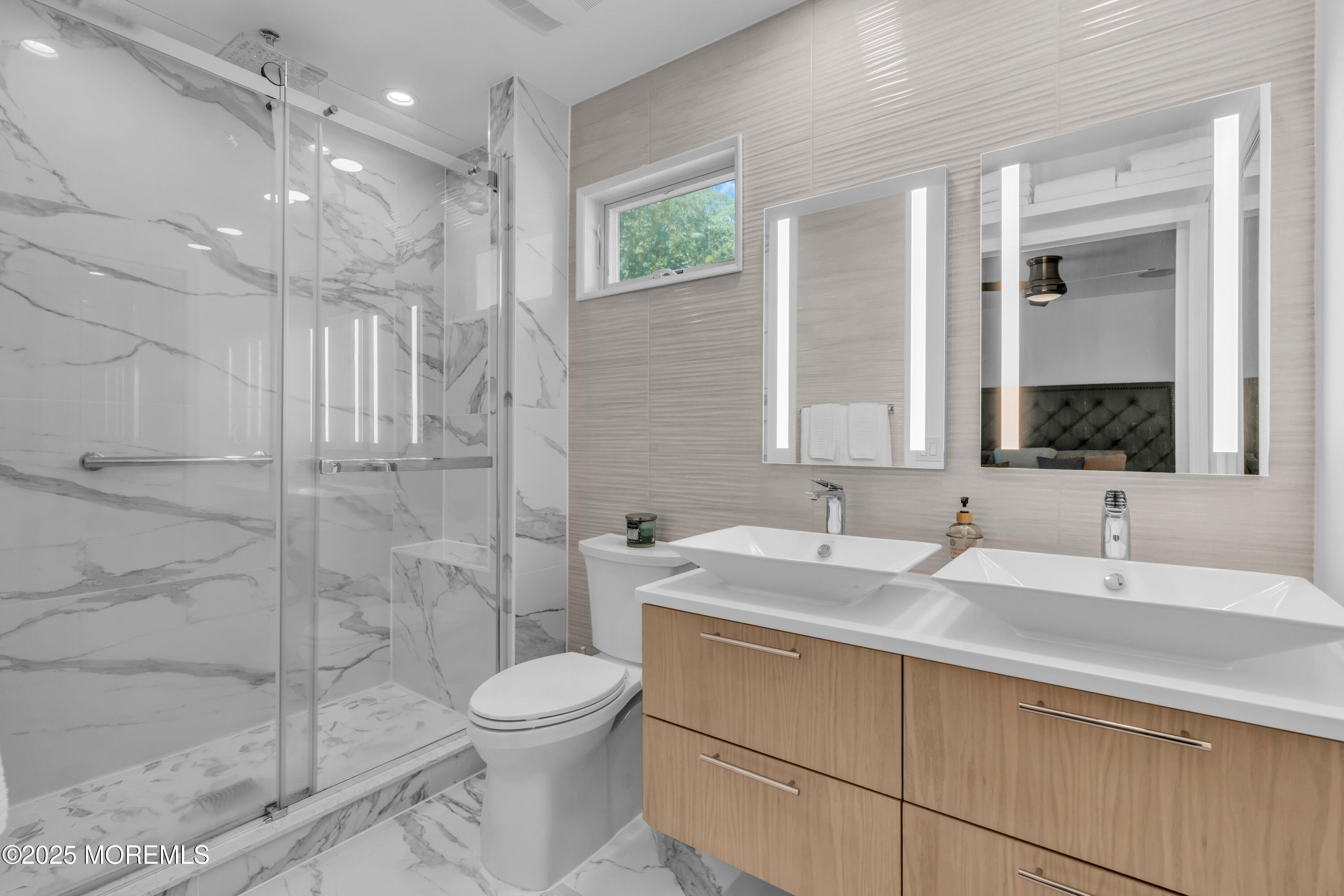 12 Locust Street Highlands, NJ 07732 - Photo 36 of 47 a bathroom with a double vanity sink toilet and shower