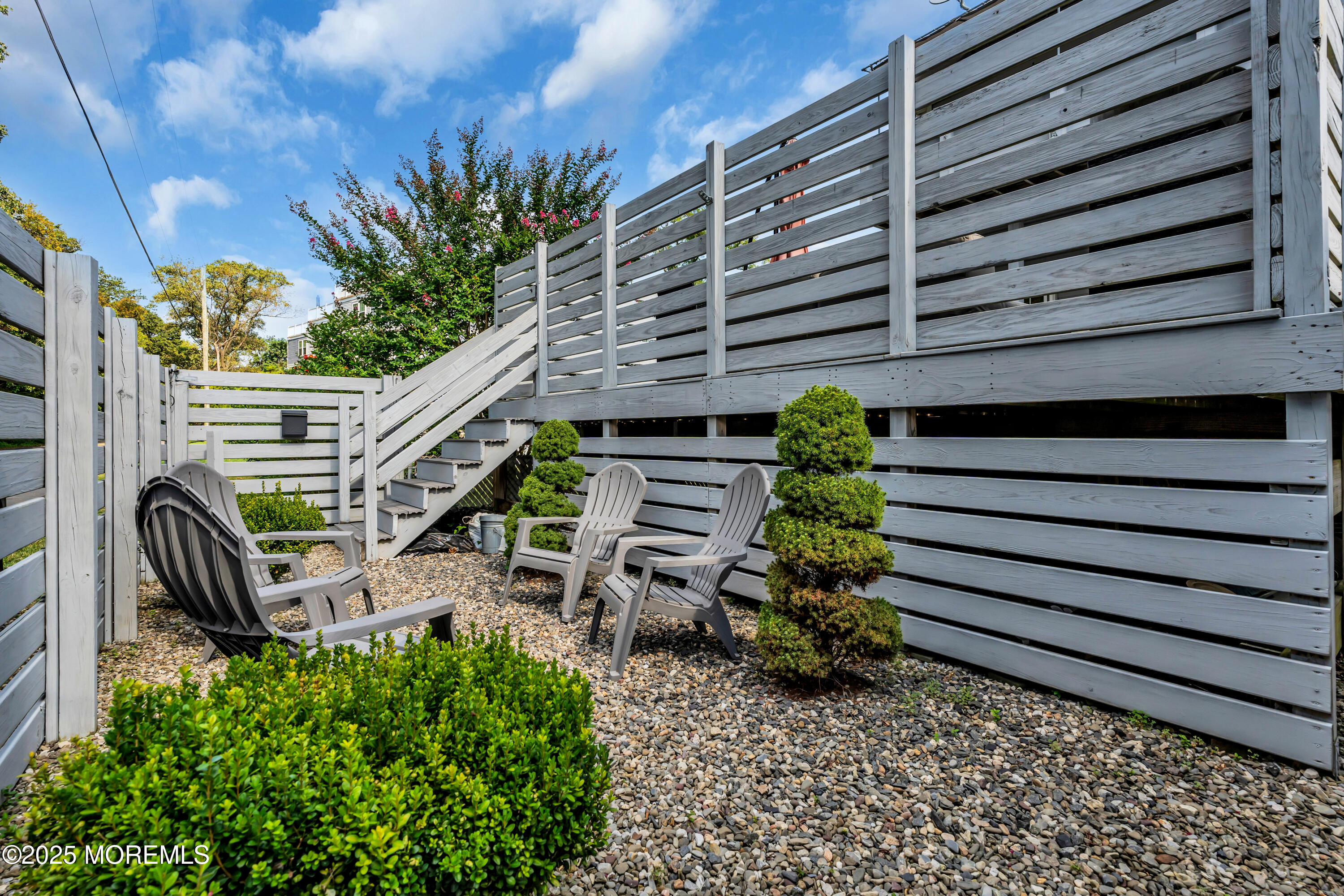 12 Locust Street Highlands, NJ 07732 - Photo 40 of 47 a view of a chairs and table in the patio