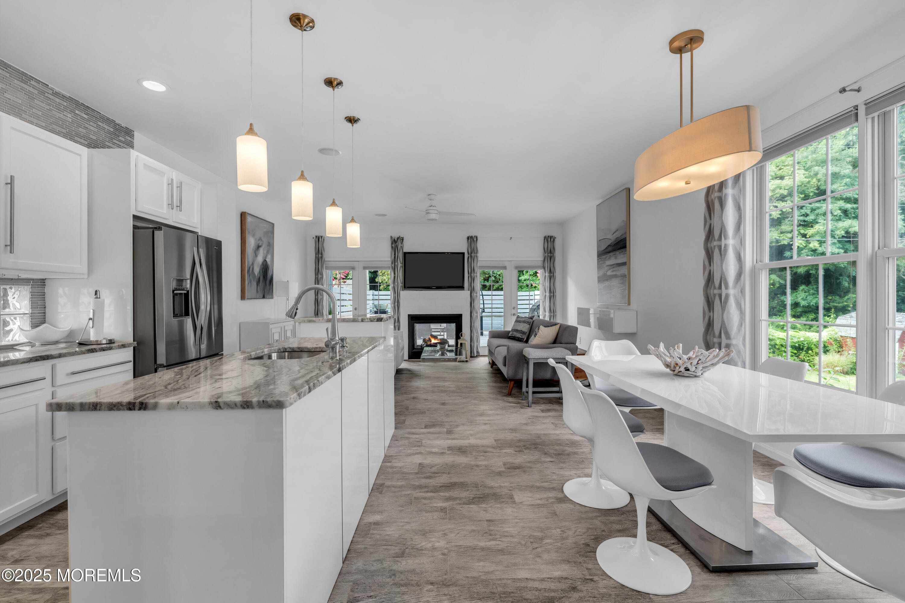 12 Locust Street Highlands, NJ 07732 - Photo 6 of 47 a large kitchen with kitchen island a large counter top space appliances and a living room view