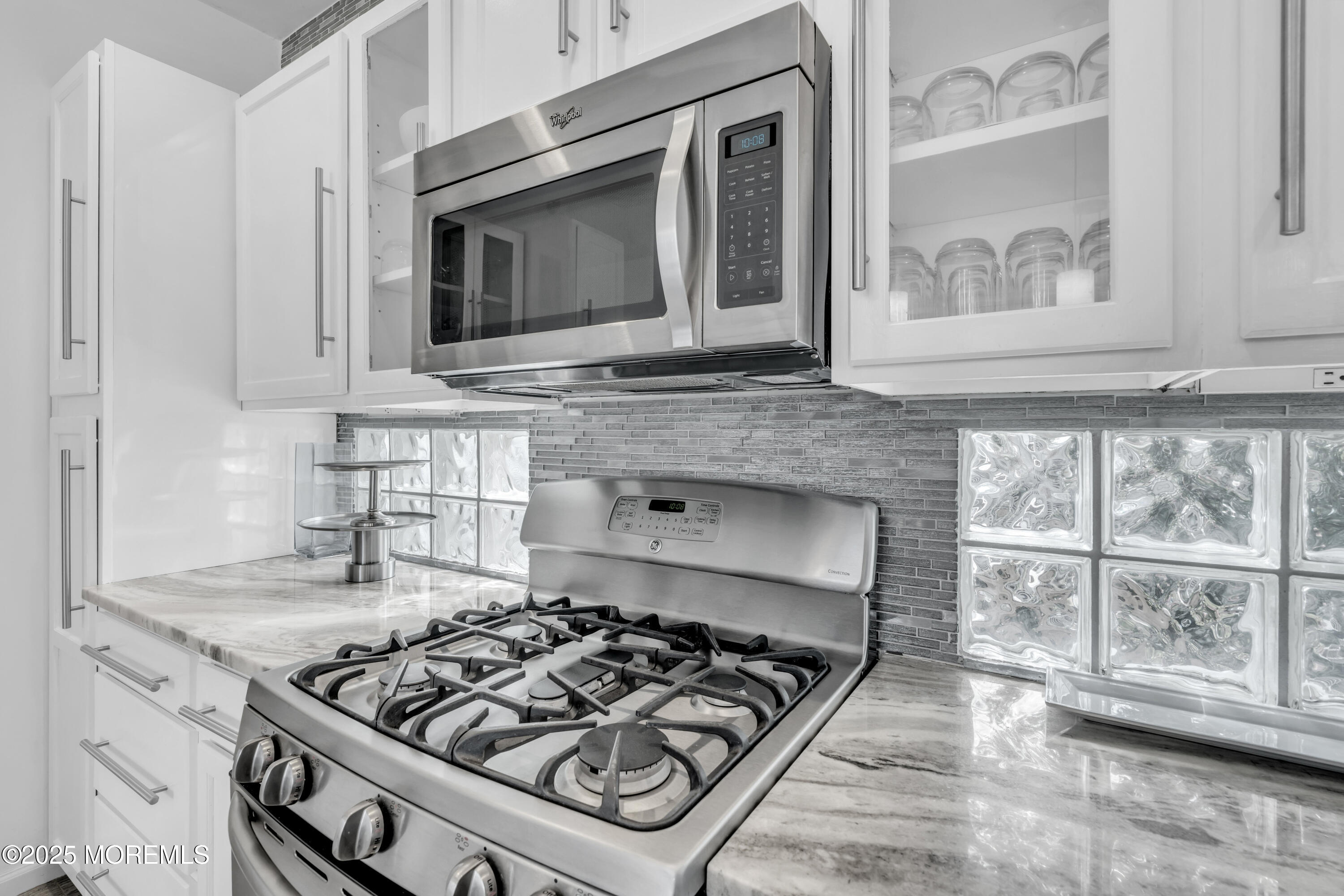 12 Locust Street Highlands, NJ 07732 - Photo 8 of 47 a kitchen with granite countertop a stove and a sink