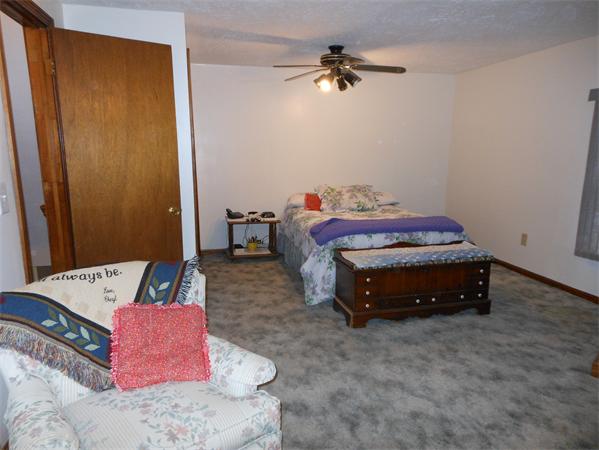 29 Stafford Road Monson, MA 01057 - Photo 8 of 14 a bedroom with a bed and a chandelier