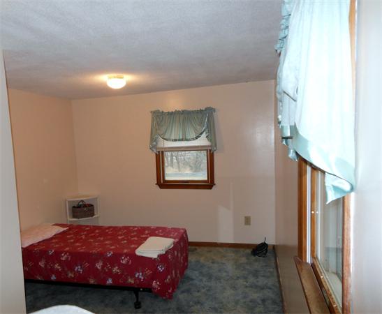29 Stafford Road Monson, MA 01057 - Photo 9 of 14 a bedroom with a bed and a window