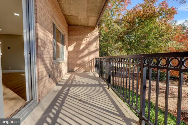 a view of a balcony with wooden floor