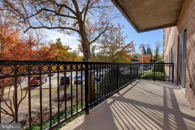 a view of a balcony with wooden fence