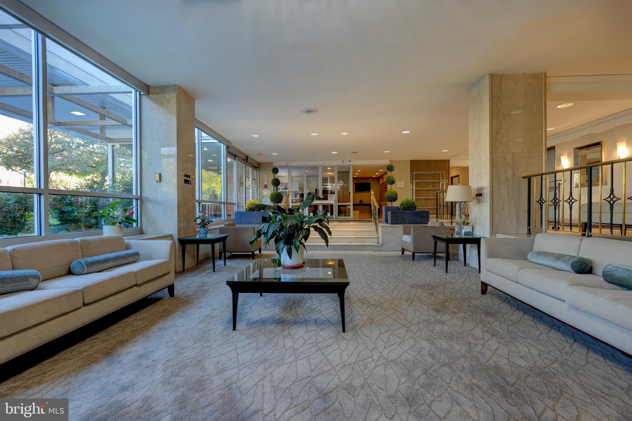 1900 Lyttonsville Road, Unit 211 Silver Spring, MD 20910 - Photo 35 of 46 a living room with furniture and a potted plant