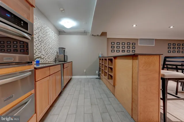 a view of an entryway with wooden floor