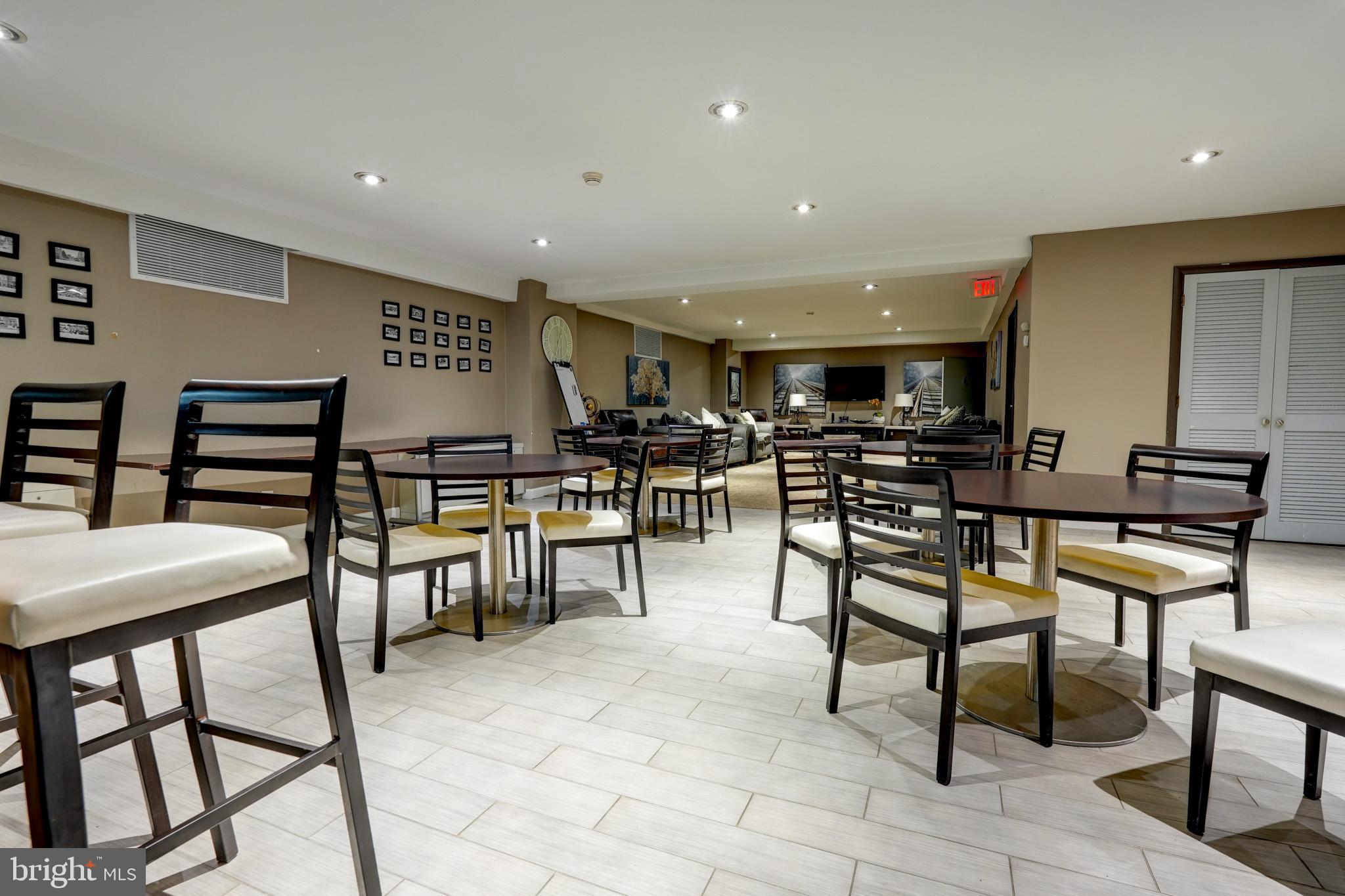 1900 Lyttonsville Road, Unit 211 Silver Spring, MD 20910 - Photo 39 of 46 a view of a dining area with furniture