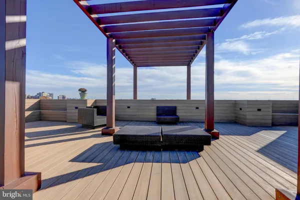 a living room with couch and wooden floor