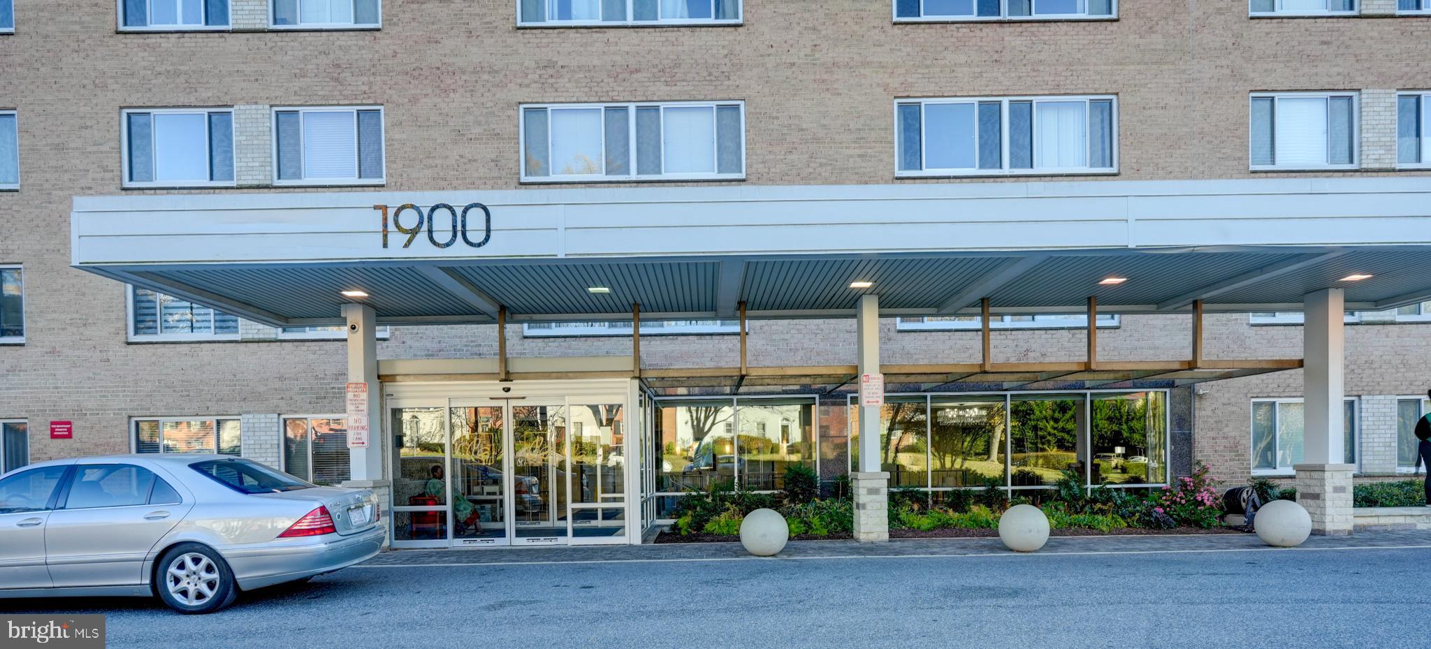 1900 Lyttonsville Road, Unit 211 Silver Spring, MD 20910 - Photo 44 of 46 a car parked in front of a building