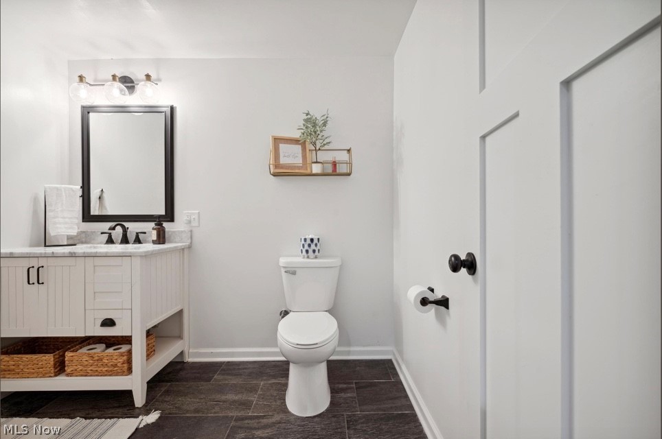 405 East Luchsinger Road Port Clinton, OH 43452 - Photo 33 of 40 Bathroom featuring toilet, tile floors, and vanity