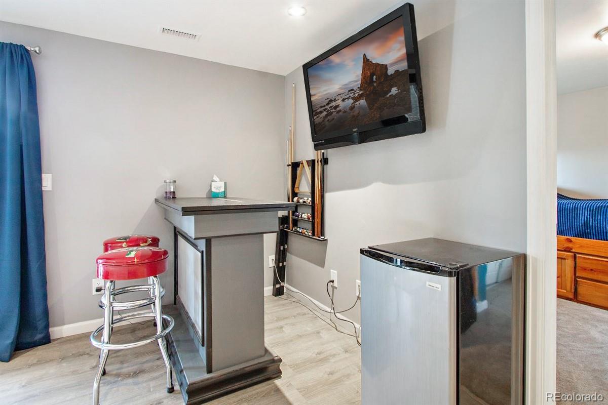 191 Renaud Road Bailey, CO 80421 - Photo 17 of 28 a utility room with dryer washer and a view of living area
