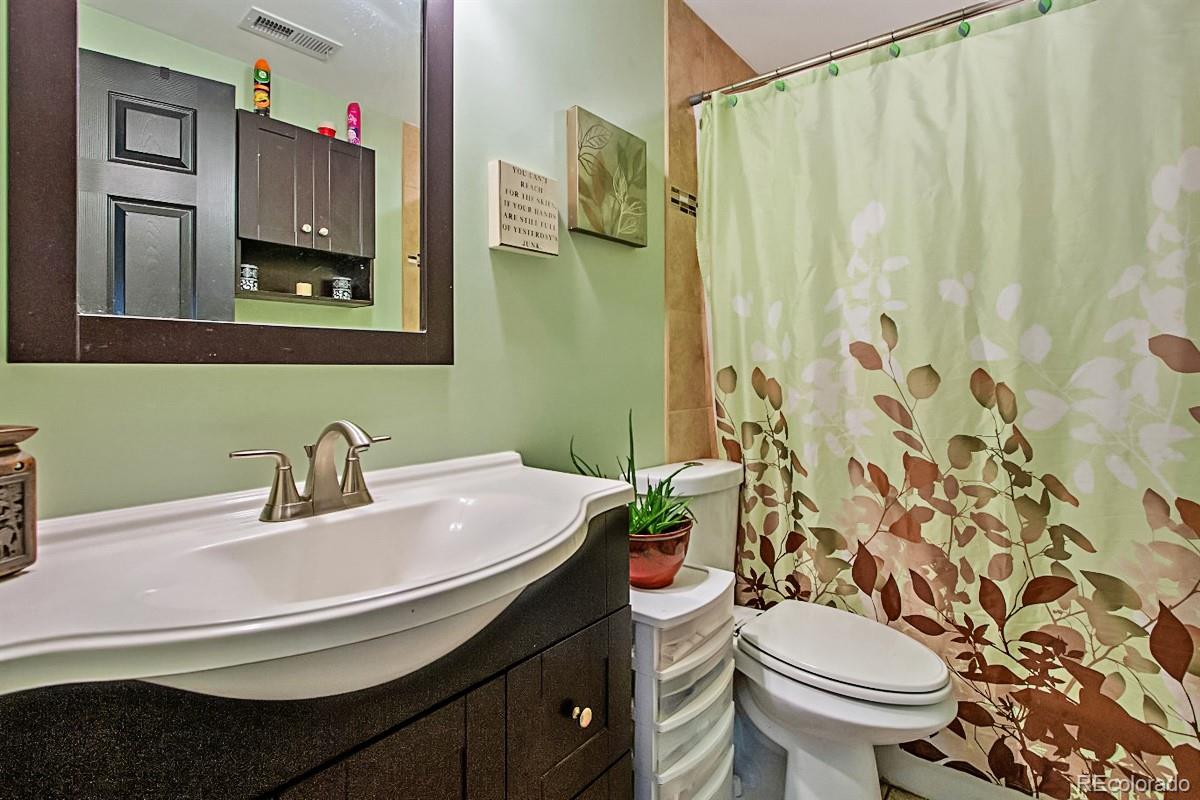 191 Renaud Road Bailey, CO 80421 - Photo 18 of 28 a bathroom with a sink and a mirror