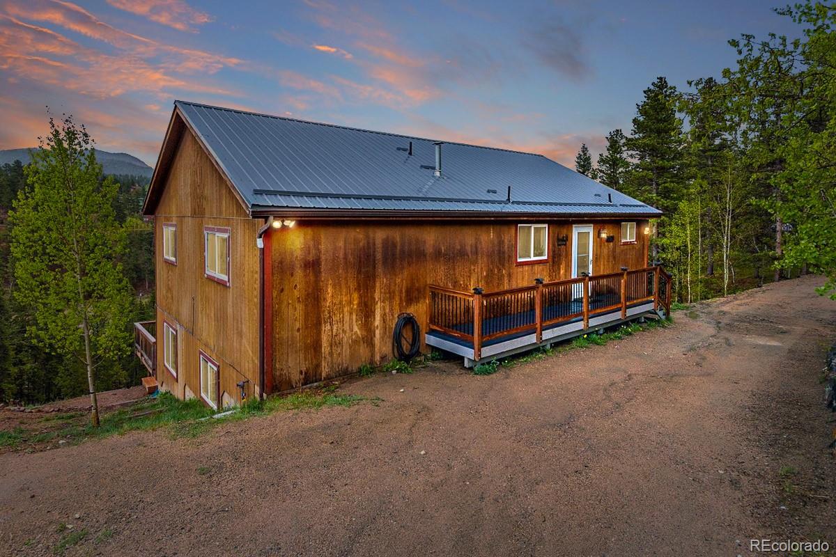 191 Renaud Road Bailey, CO 80421 - Photo 27 of 28 a view of a house with a yard