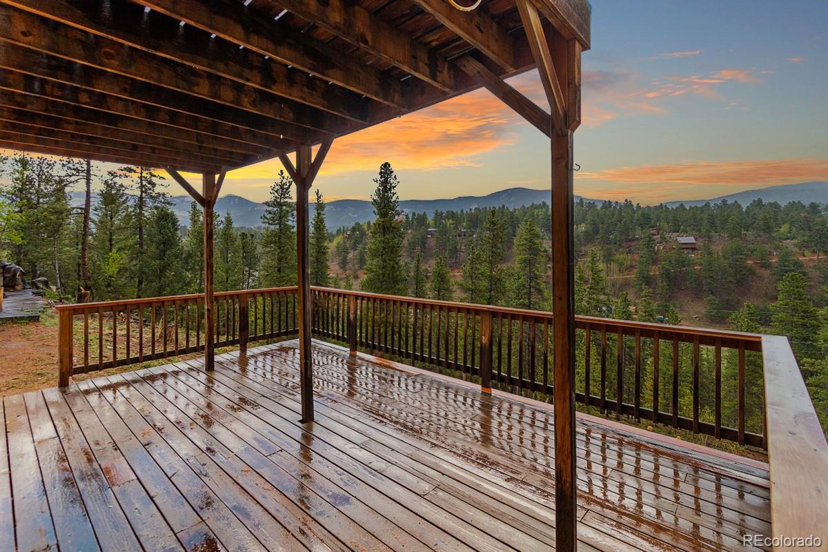 191 Renaud Road Bailey, CO 80421 - Photo 4 of 28 a view of balcony with wooden floor