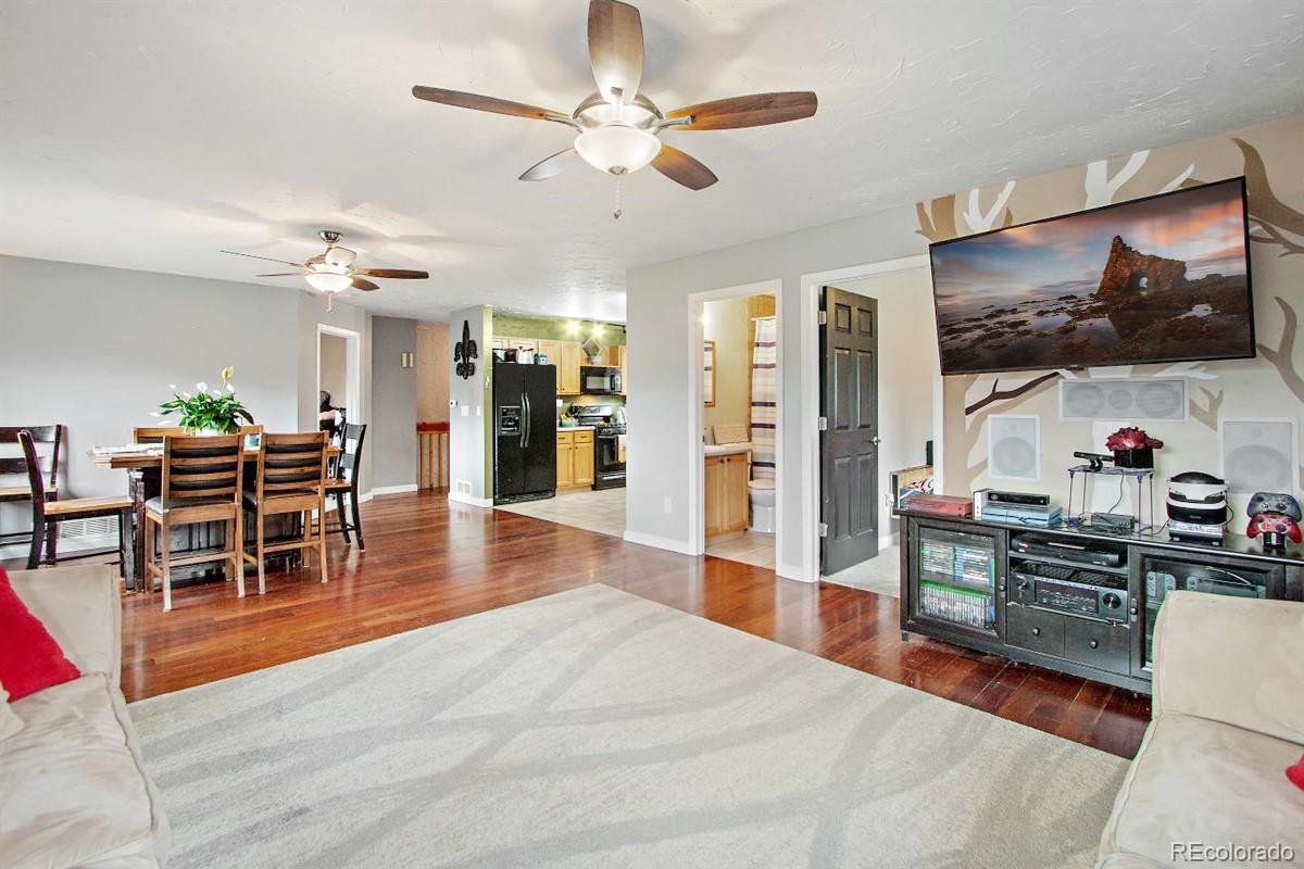191 Renaud Road Bailey, CO 80421 - Photo 9 of 28 a living room with stainless steel appliances kitchen island granite countertop furniture and a kitchen view