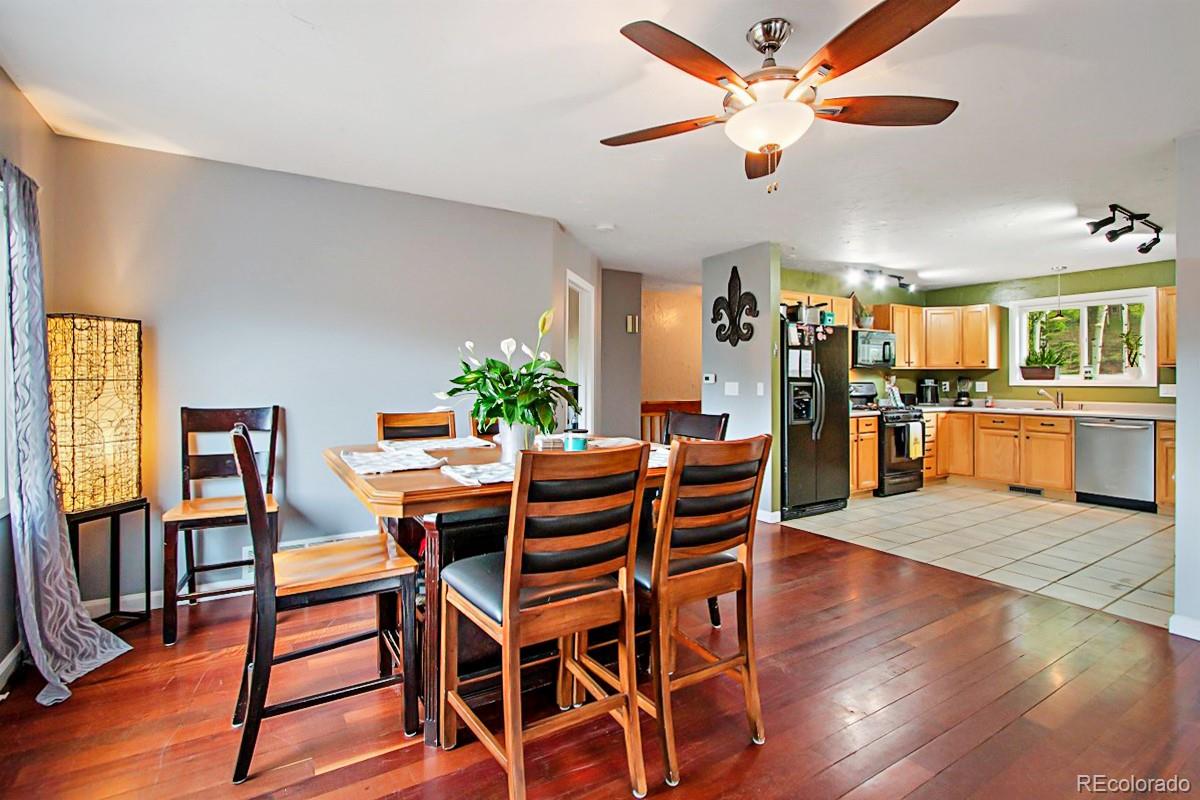 191 Renaud Road Bailey, CO 80421 - Photo 10 of 28 a view of a dining room with furniture and wooden floor