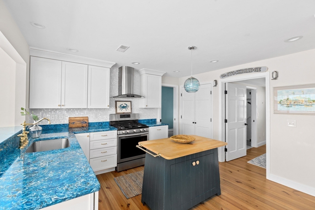 30 Lighthouse Road Scituate, MA 02066 - Photo 11 of 36 a kitchen with a sink refrigerator and cabinets