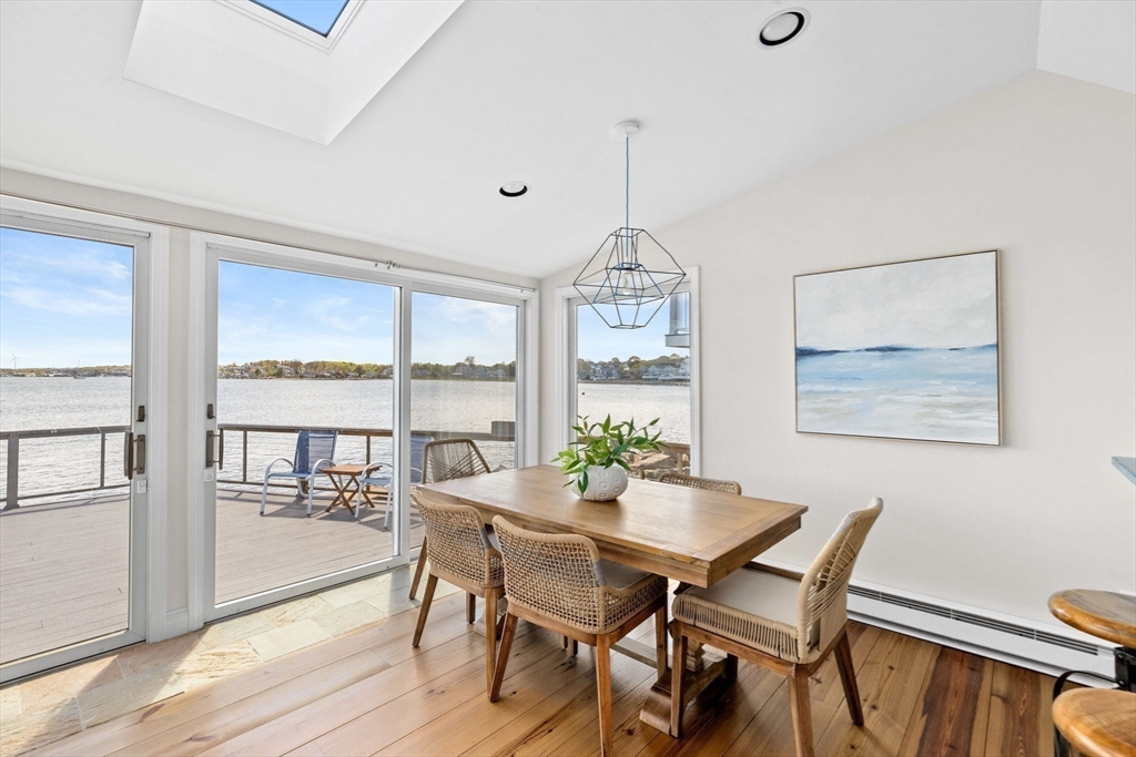 30 Lighthouse Road Scituate, MA 02066 - Photo 12 of 36 a view of a dining room with furniture window and wooden floor