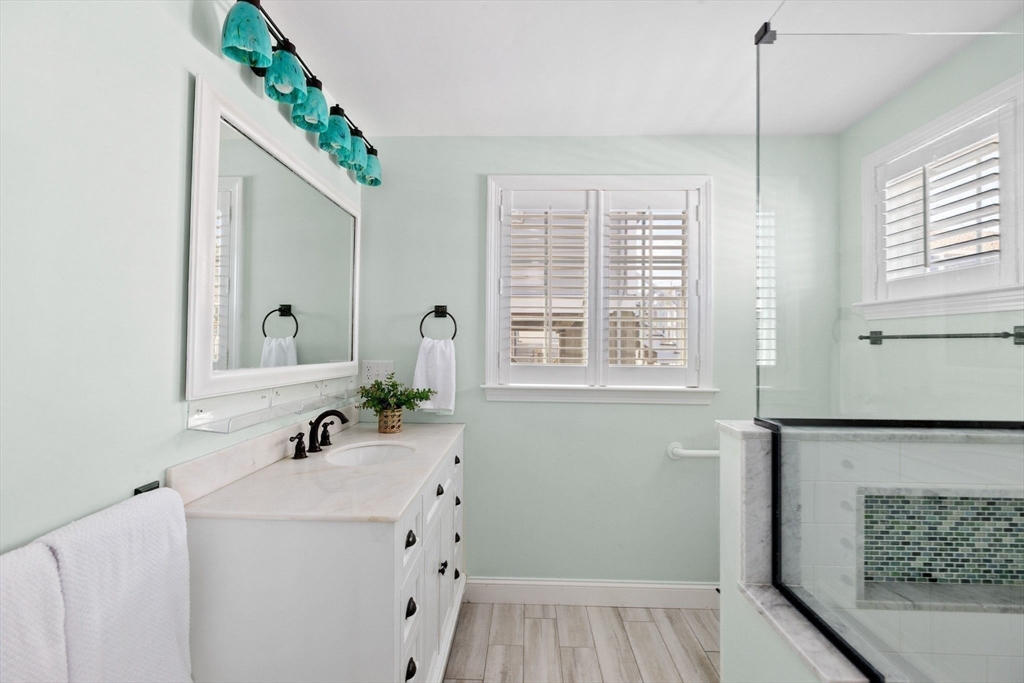 30 Lighthouse Road Scituate, MA 02066 - Photo 20 of 36 a bathroom with a sink and a mirror