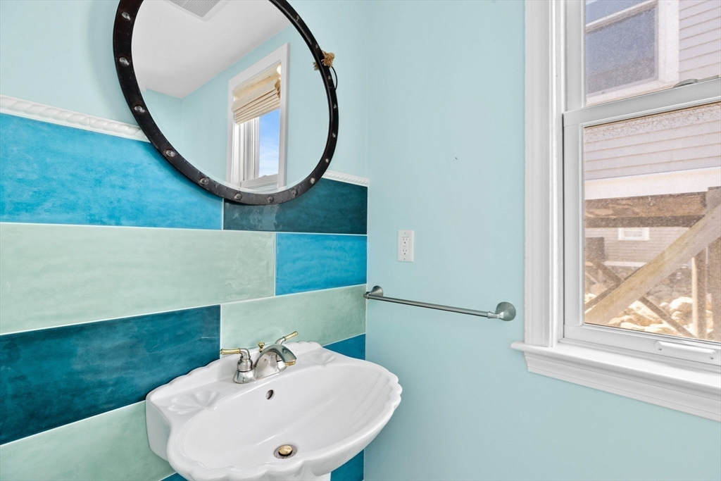 30 Lighthouse Road Scituate, MA 02066 - Photo 22 of 36 a bathroom with a sink and a mirror