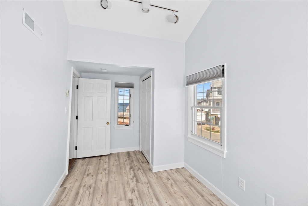 30 Lighthouse Road Scituate, MA 02066 - Photo 28 of 36 a view of a room with wooden floor and windows