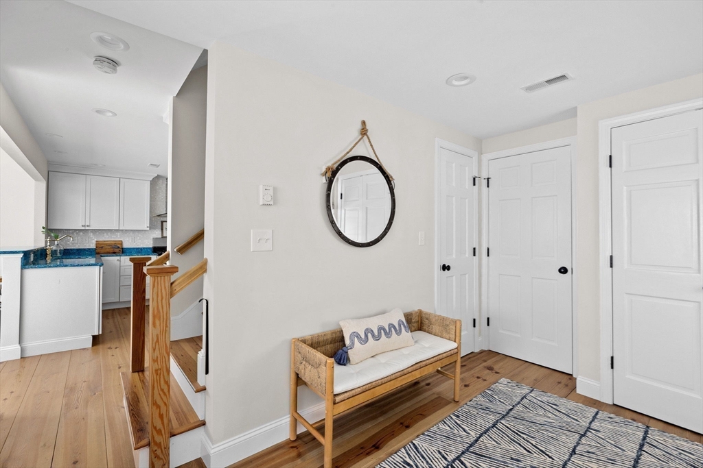 30 Lighthouse Road Scituate, MA 02066 - Photo 5 of 36 a living room with furniture a wooden floor and a large window