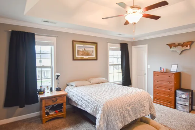 a bedroom with a bed and a dresser