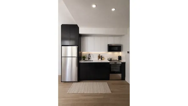 a kitchen with a sink and refrigerator