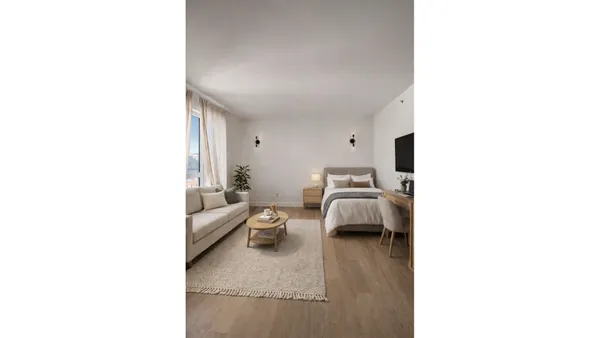 a living room with furniture and a window