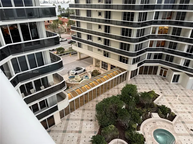 a kitchen with stainless steel appliances kitchen island granite countertop a sink and cabinets