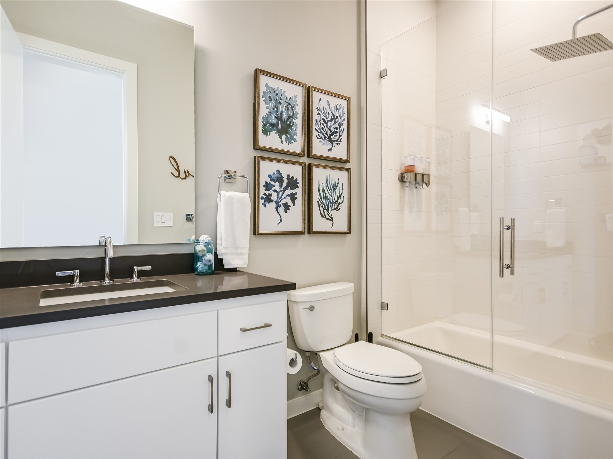 5921 Hiline Road, Unit 1501 Austin, TX 78734 - Photo 21 of 38 a bathroom with a granite countertop toilet sink and a mirror