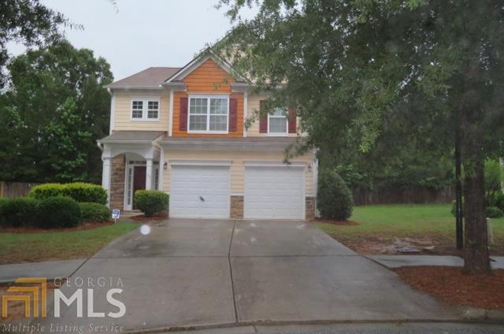 115 Thrasher Way Covington, GA 30014 - Photo 1 of 1 a front view of a house with garden