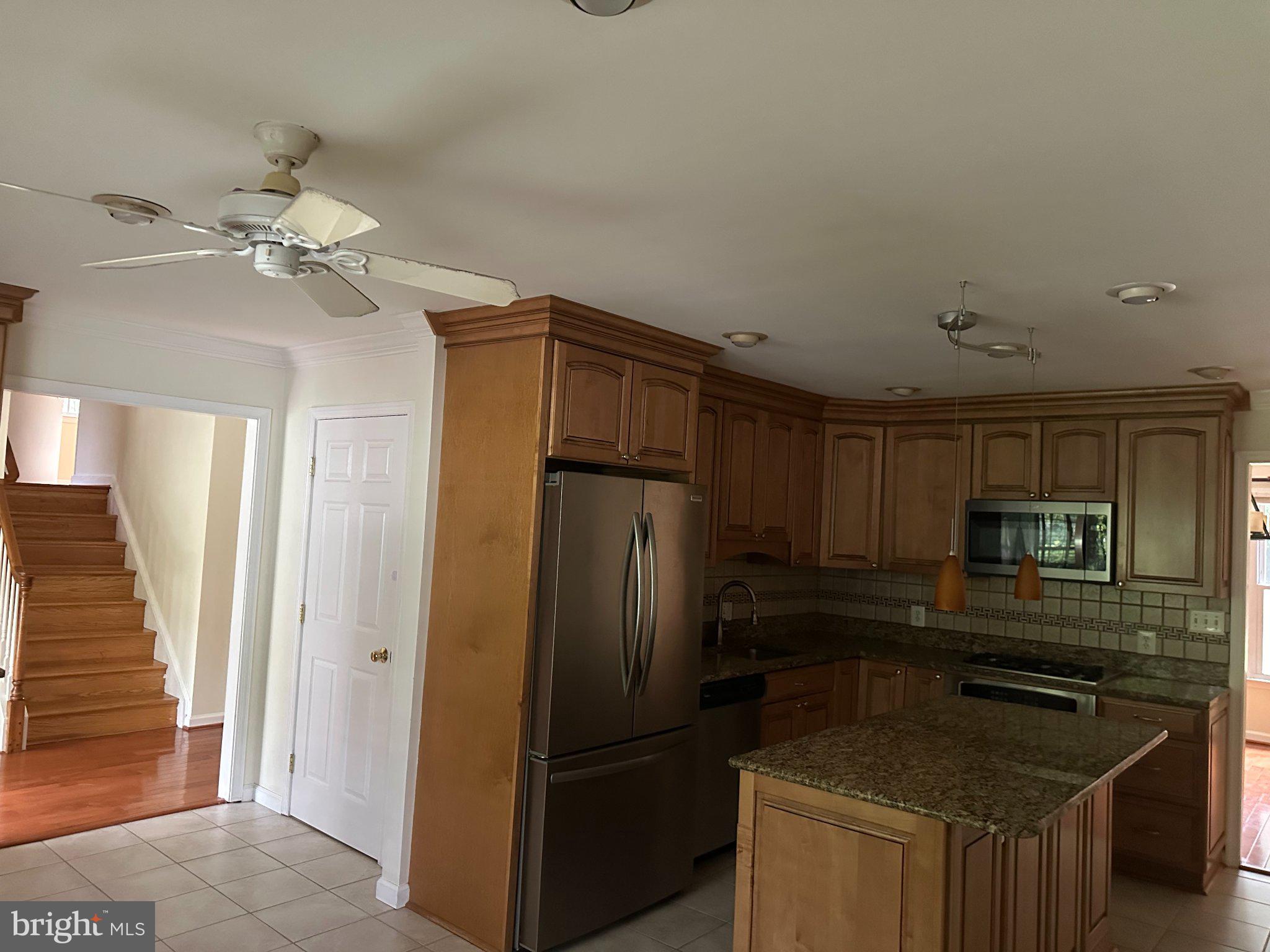 2505 Rocky Branch Road Vienna, VA 22181 - Photo 4 of 11 Modern kitchen with warm wood tones.