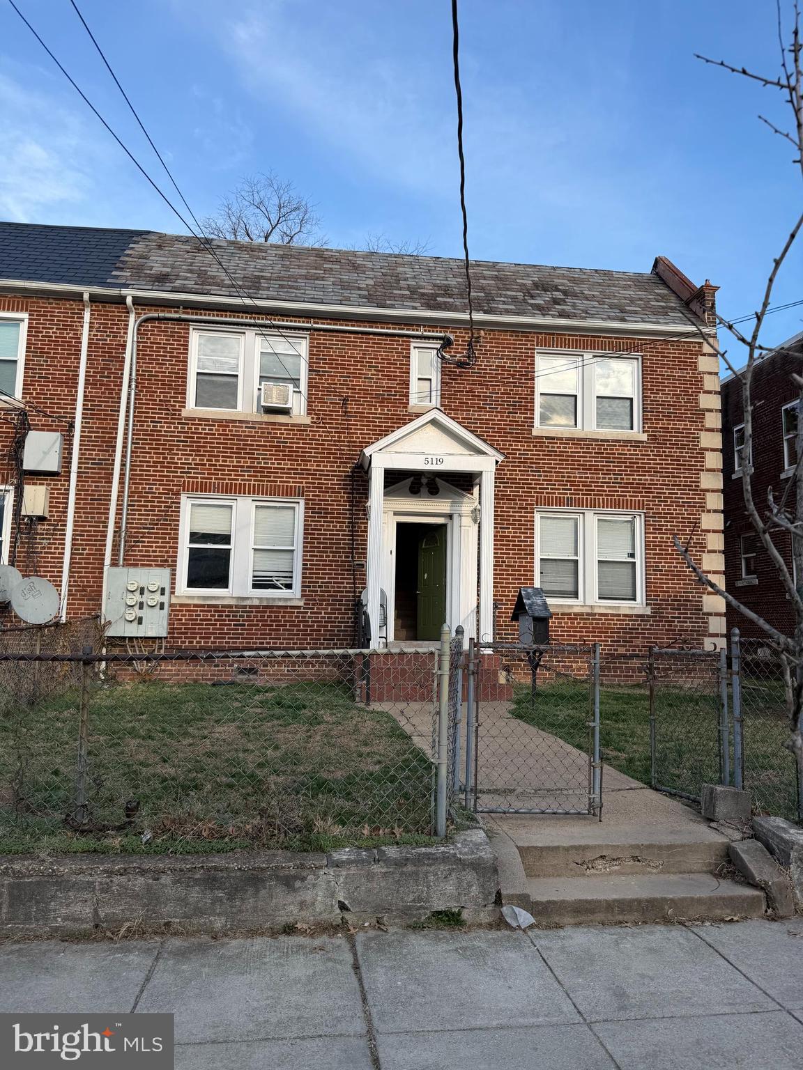 5119 2nd Street Northwest, Unit 4 Washington, DC 20011 - Photo 1 of 6 a front view of a house with a garden