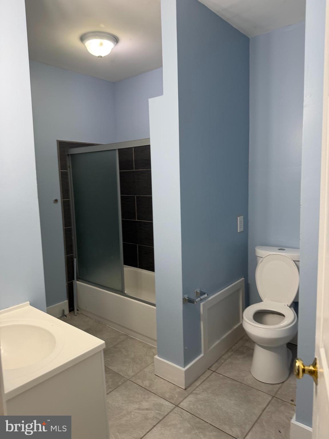 5119 2nd Street Northwest, Unit 4 Washington, DC 20011 - Photo 3 of 6 a bathroom with a toilet and a shower