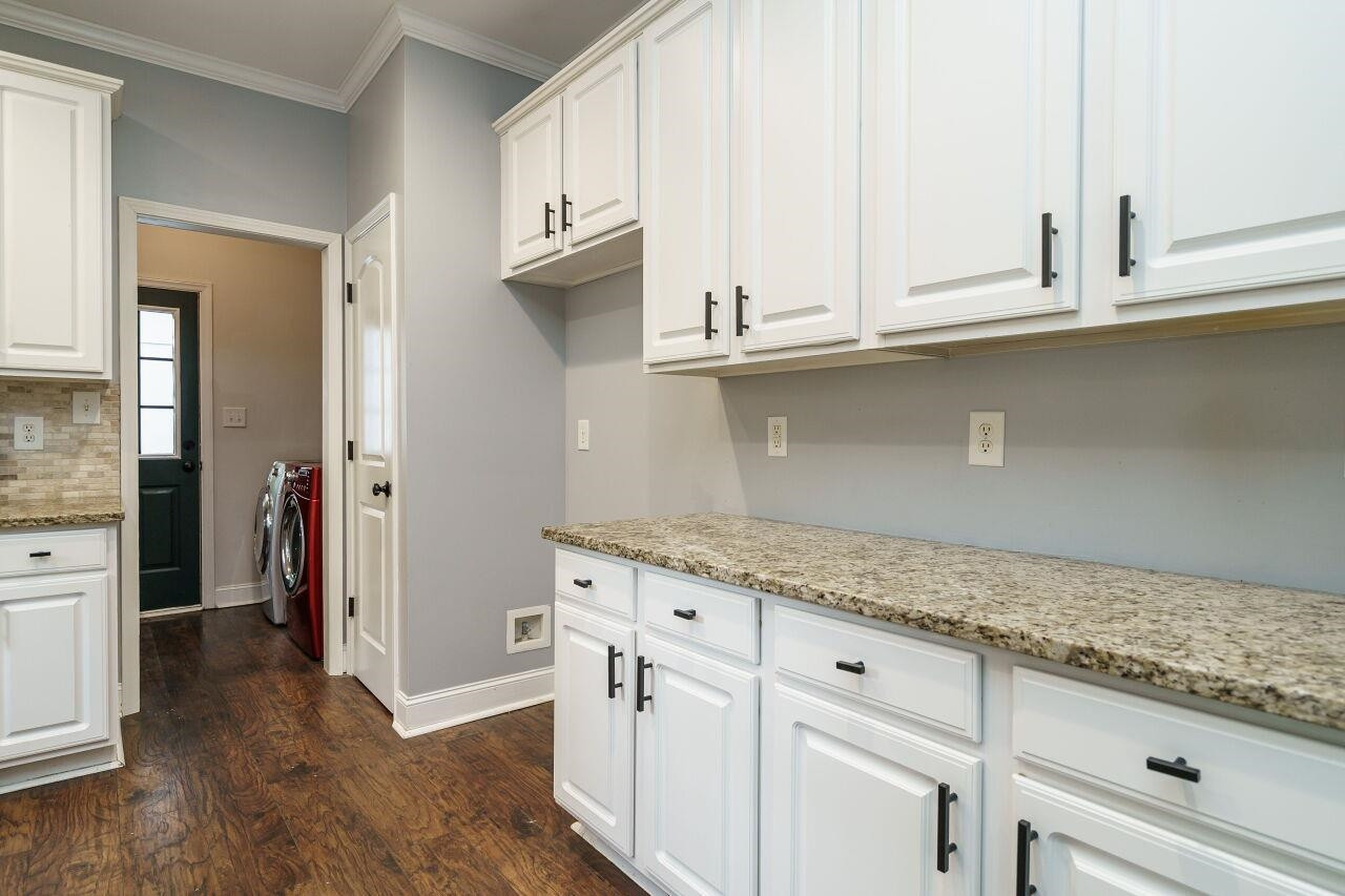 4202 Holt School Road Durham, NC 27704 - Photo 12 of 27 A convenient pantry adds even more storage options, ensuring you have everything you need at your fingertips. Kitchen