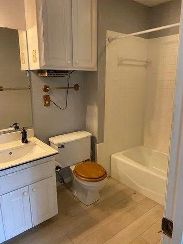 a bathroom with a sink a toilet and bathtub