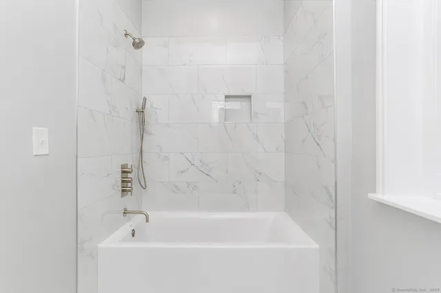 a close view of a bathtub in bathroom
