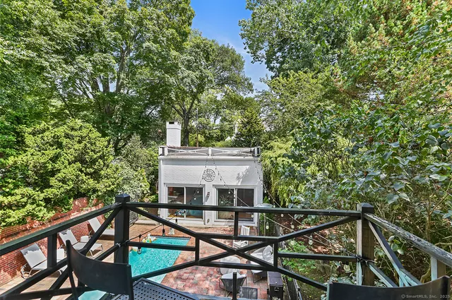 a view of a balcony with furniture