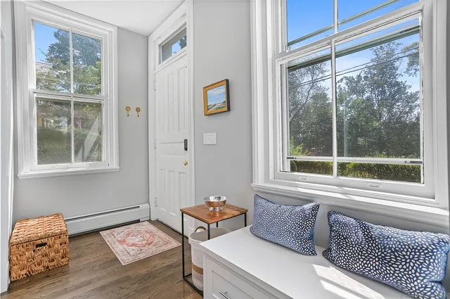 a bedroom with furniture and a window
