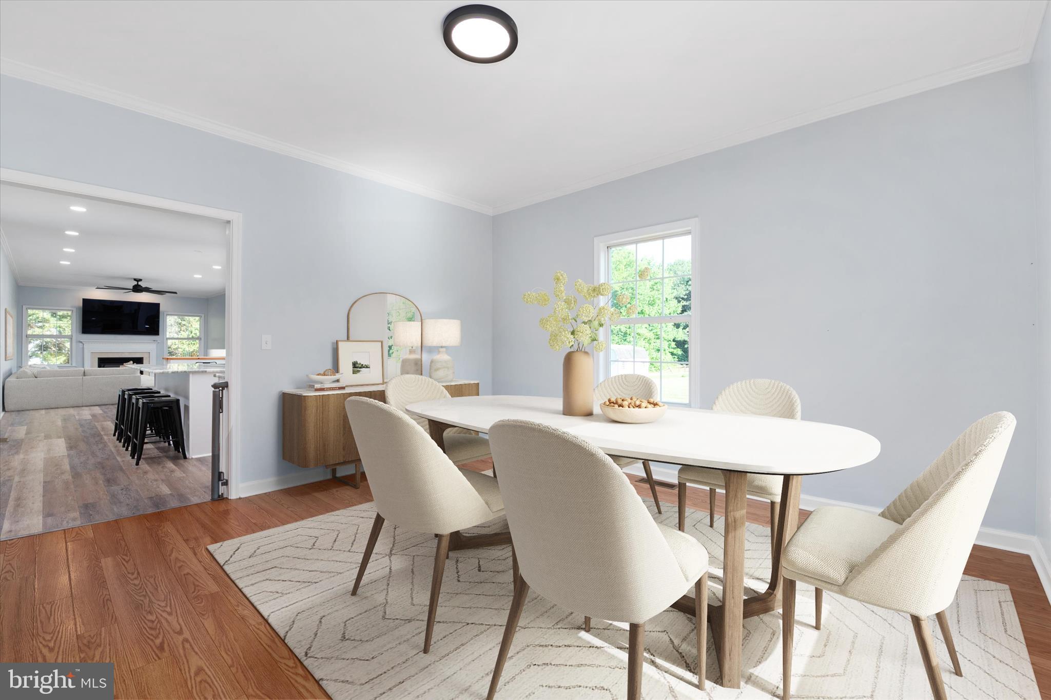 913 Clark Corner Road Centreville, MD 21617 - Photo 19 of 66 a view of a dining room with furniture and a wooden floor