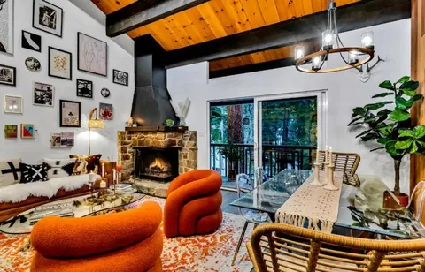 a view of a livingroom with furniture and a fireplace