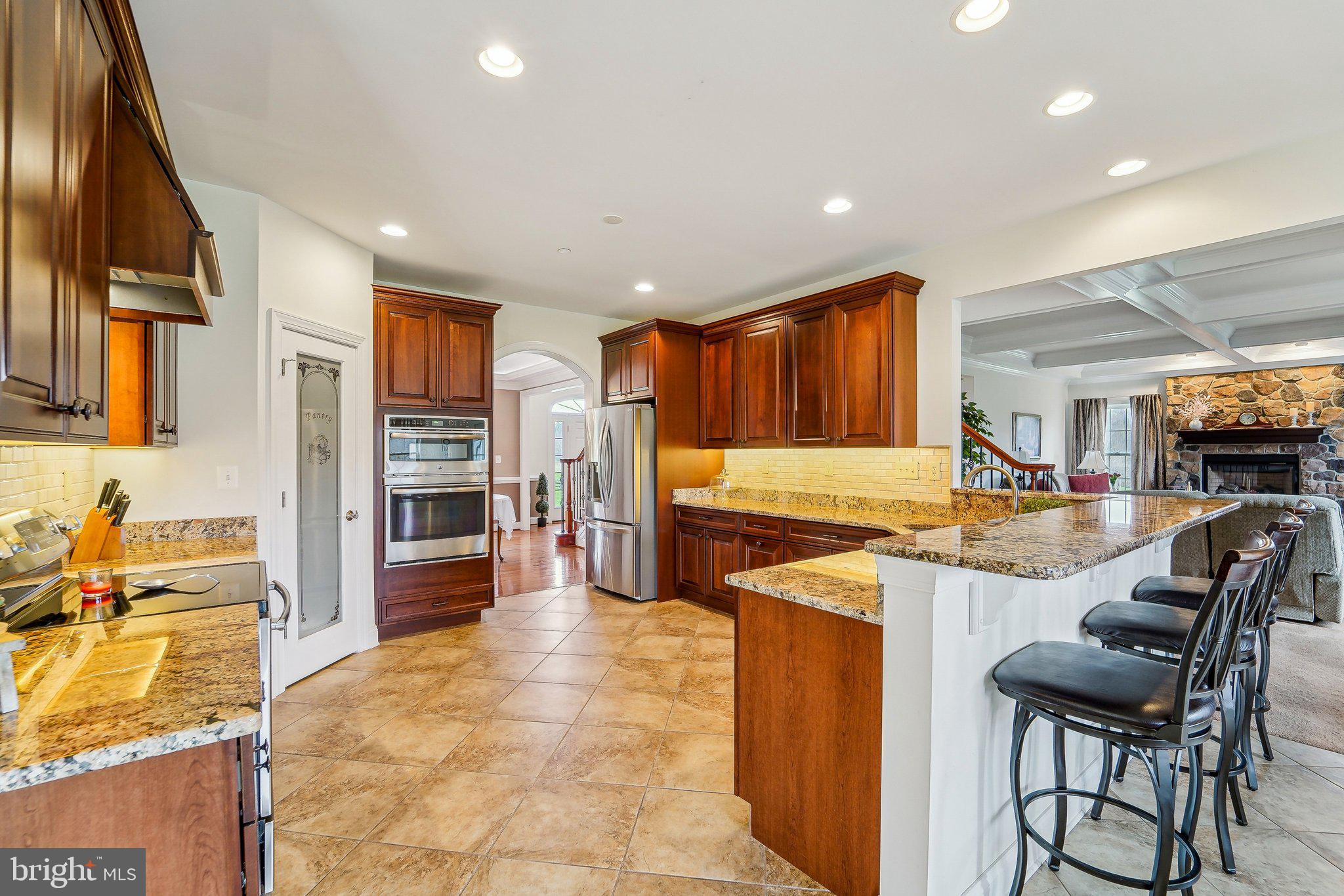 13936 Rover Mill Road West Friendship, MD 21794 - Photo 11 of 73 a kitchen with stainless steel appliances granite countertop a sink and a refrigerator