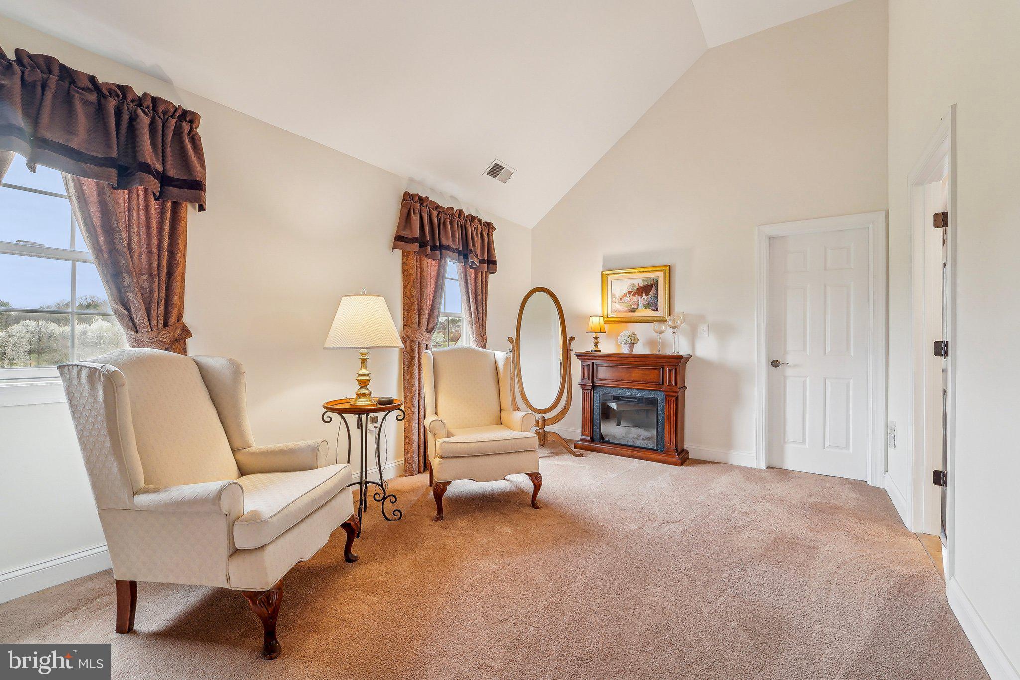 13936 Rover Mill Road West Friendship, MD 21794 - Photo 21 of 73 a living room with furniture a fireplace and a large window