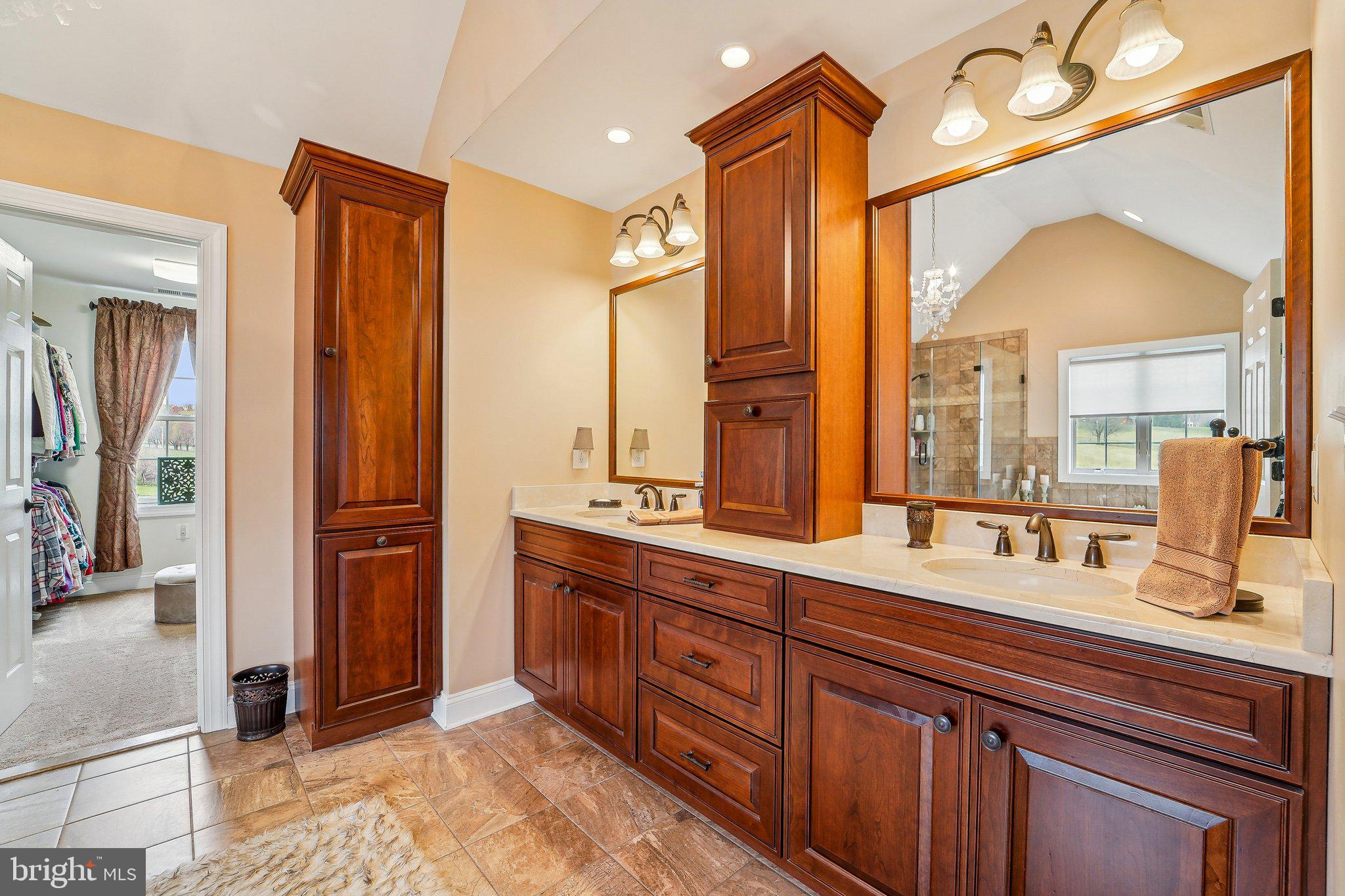 13936 Rover Mill Road West Friendship, MD 21794 - Photo 22 of 73 a bathroom with a double vanity sink and a mirror